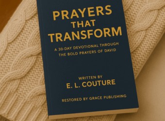 A paperback copy of Prayers That Transform by E. L. Couture resting on a beige cable-knit throw draped over a soft armchair, creating a warm and cozy setting for a Christian devotional Christmas gift that encourages deeper prayer and faith.